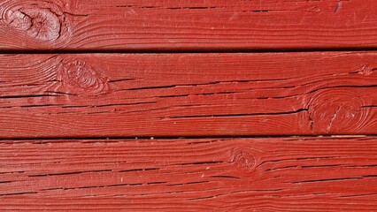 Fondo con detalle y textura de varios tablones con vetas y nudos, con tonos de color rojo