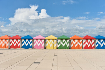 Colorful beach huts in front of historic seaside buildings at Malo-Les-Bains beach in Dunkirk, france