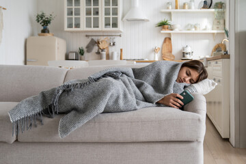 Social Media depression in teens. Unhappy depressed teen girl child lying on sofa with smartphone...