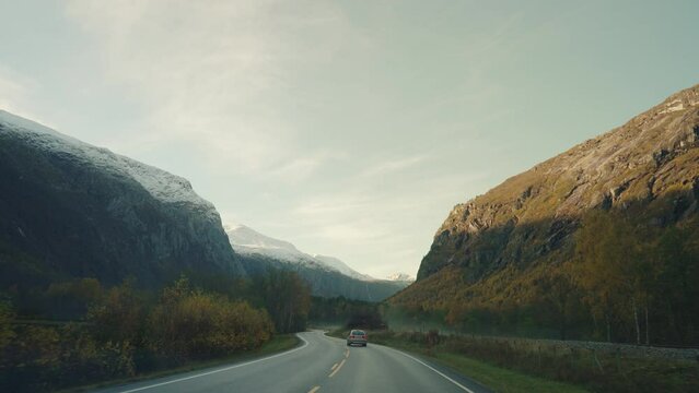 Driving on Norwegian roads with beautiful moutain landscape