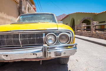 retro car parked at tilcara town, argentina