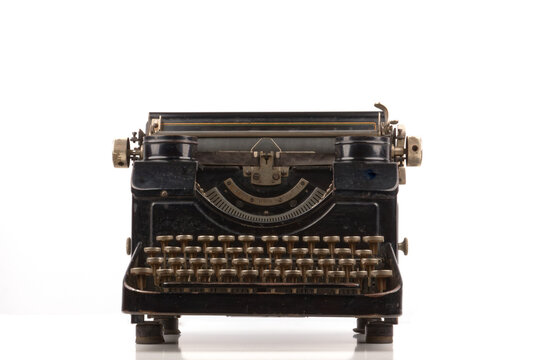 old vintage typewriter isolated on white background with real shadows
