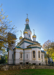 view of the Russian Church in downtown Sofia surrounded by warm autumn foliage