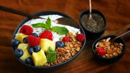 Breakfast bowl with chia yogurt, berries and fruits. Healthy snack or dessert.