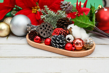 Christmas material, X'mas Flower and ball decorations on wood background.