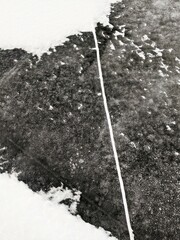 Crack in the ice on a frozen lake