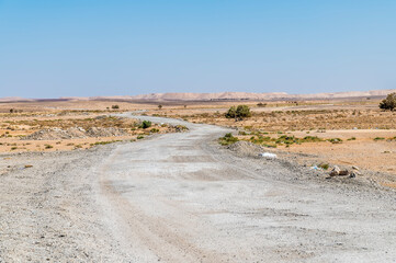 A view down the desert road beside the Jordan Valley highway  in summertime