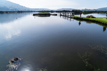 Beautiful lagoon near mountains and a city, Colta Lake