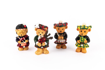 Cute figures of scotish bears playing instruments
