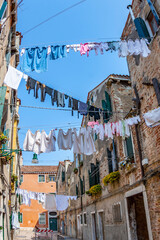 clothes on a clothesline in a narrow street in Venice