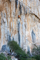 rock climber climbs the route.