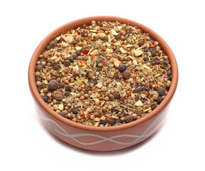 Spice blend, garam masala, mix black pepper, coriander, cumin, garlic granules, allspice, sea ​​salt, ground chili peppers, cinnamon, cloves grain, chopped ginger, bay leaves in bowl isolated on white