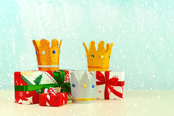 Three crowns of the three wise men with christmas gift boxes. Concept for Reyes Magos day. Three...