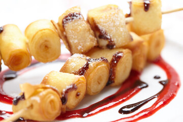 fried sweet rolls with sauce