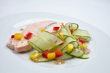 salmon with vegetables on white plate