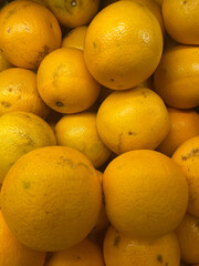 Oranges on the market, closeup of oranges on the table