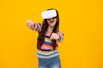 Amazed teenager. Portrait of young teen girl in VR helmet, isolated on yellow. Gamer playing VR games, VR gaming. Excited teen girl.