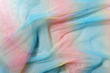 Texture of multicolored transparent fabric background, homework, hobbies, knitting, needlework.