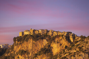 Fototapeta premium Panorama of beautiful countryside sunset view of Norma, Latina near Rome, Italy. A wonderful rock of the roman colony. Wonderful springtime landscape in mountains with rural scene