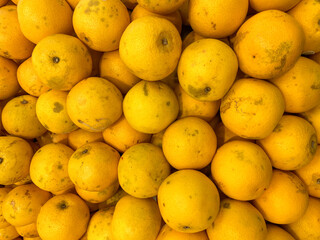 Fresh orange fruit as background, top view of orange, closeup view