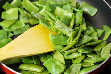 Green beans in a pan ready for cooking. Vegetable preservation. Selective focus