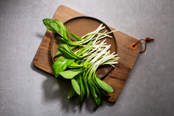 Edible wild garlic leek on kitchen board food