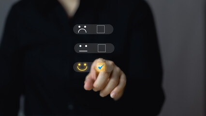 Customer service and Satisfaction concept , People are touching the virtual screen on the happy Smile face icon to give satisfaction in service. rating very impressed.