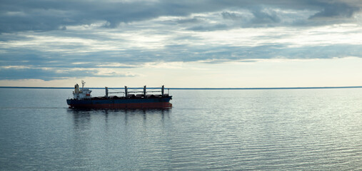 Cargo Ship in Gulf of Riga At Dusk