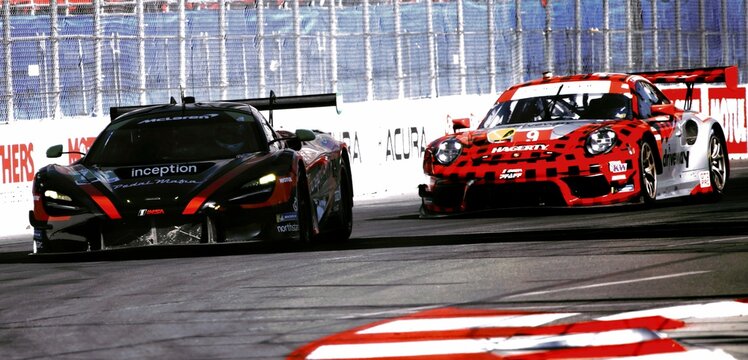 Racing Final Lap Of McLaren And Porsche In The Corner Action