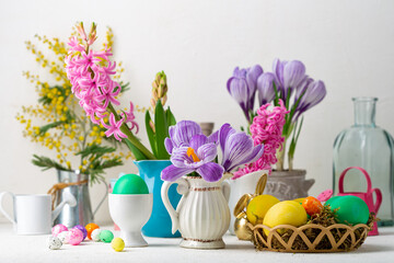 Spring flowers in pot and pitcher Easter background
