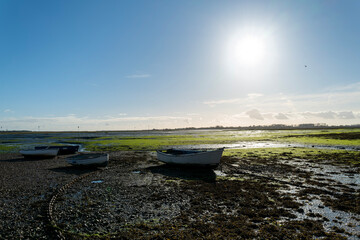 Small rowing boats at low tide on the Hampshire coast, south England