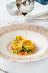 kreplach in chicken soup in restaurant