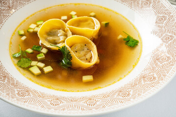 kreplach in chicken soup in restaurant