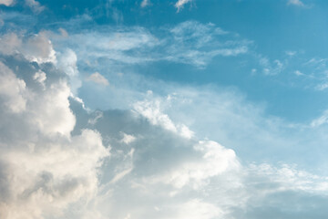 Dramatic heaven during daytime. Cloudscape scene over clear blue sky. Calm backdrop