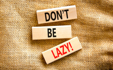 Motivational and do not be lazy symbol. Concept words Do not be lazy on wooden blocks on a beautiful canvas table canvas background. Business do not be lazy concept. Copy space.