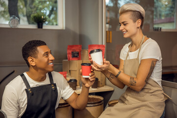 Romantic biracial couple toasting to their startup - Powered by Adobe