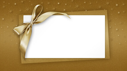 Christmas Blank gift greeting card ticket with shiny golden ribbon bow, isolated on beige...