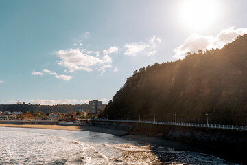 Landscape with a seaside town and a mountain