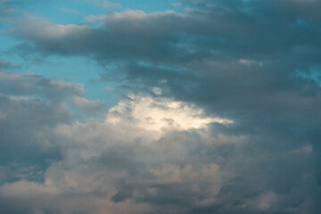 Clouds over the blue sky. Heavy formation before the rain