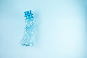 Close up of plastic stripped bottle on blue background