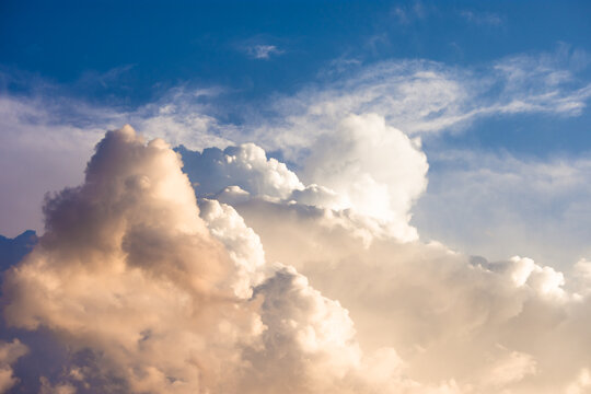 View above the clouds during sunset or sunrise. Fantastic cloudscape. Awe or tranquil dramatic sky © madrolly