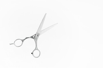 Professional Haircutting Scissors levitation. Hairdresser scissors on white background with copy...