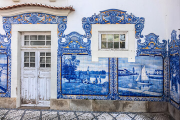 External view of Historic building of old Aveiro Railway station ornamented with typical blue...