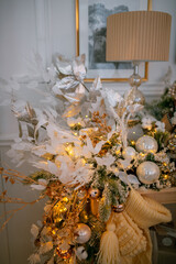 Cozy atmosphere of Christmas, holidays and New Year in the details of the interior of the Christmas room. Christmas decorations luxury