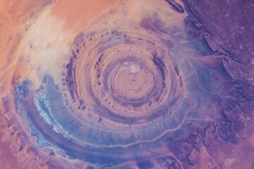 Eye of the Sahara in northwestern Mauritania Aerial view of Sahara desert. Natural abstract patterns and shapes in the nature. Colorful background. Elements of this image furnished by NASA - obrazy, fototapety, plakaty