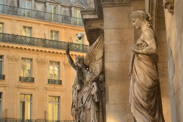 Closeup of statues of opera house named Garnier Palace in Paris, France