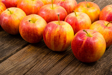 Fototapeta na wymiar apple fruits in a row, old weathered wood table background