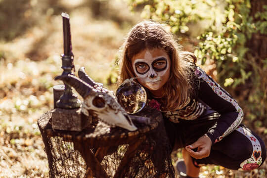 Children celebrating a Halloween costume party in the back garden