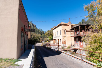 Fototapeta na wymiar Buildings along the streets of the ghost town of Mogollon during a sunny autumn day