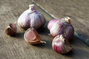 garlic. Garlic cloves on wooden vintage wooden background.